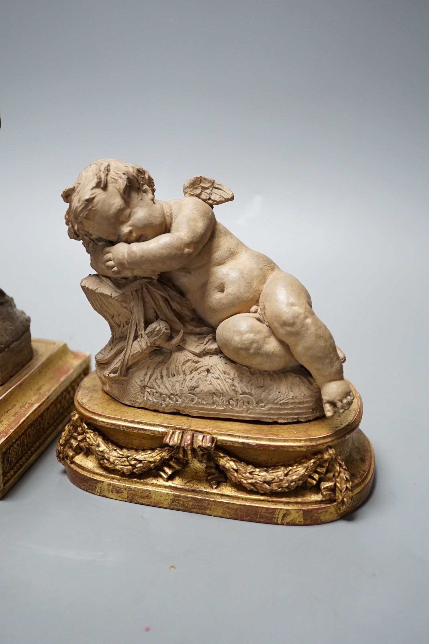 Two 19th century French terracotta cherubs and one other Cupid, after Clodion, all on giltwood stands, tallest 23.5cm